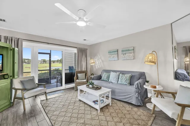 a living room with furniture and a table