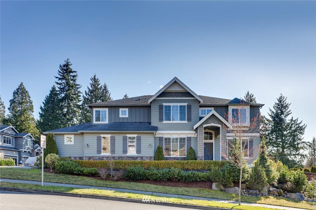 3110 222nd Street Southeast Bothell, WA 98021 - Photo 1 of 23 a front view of a house with a yard