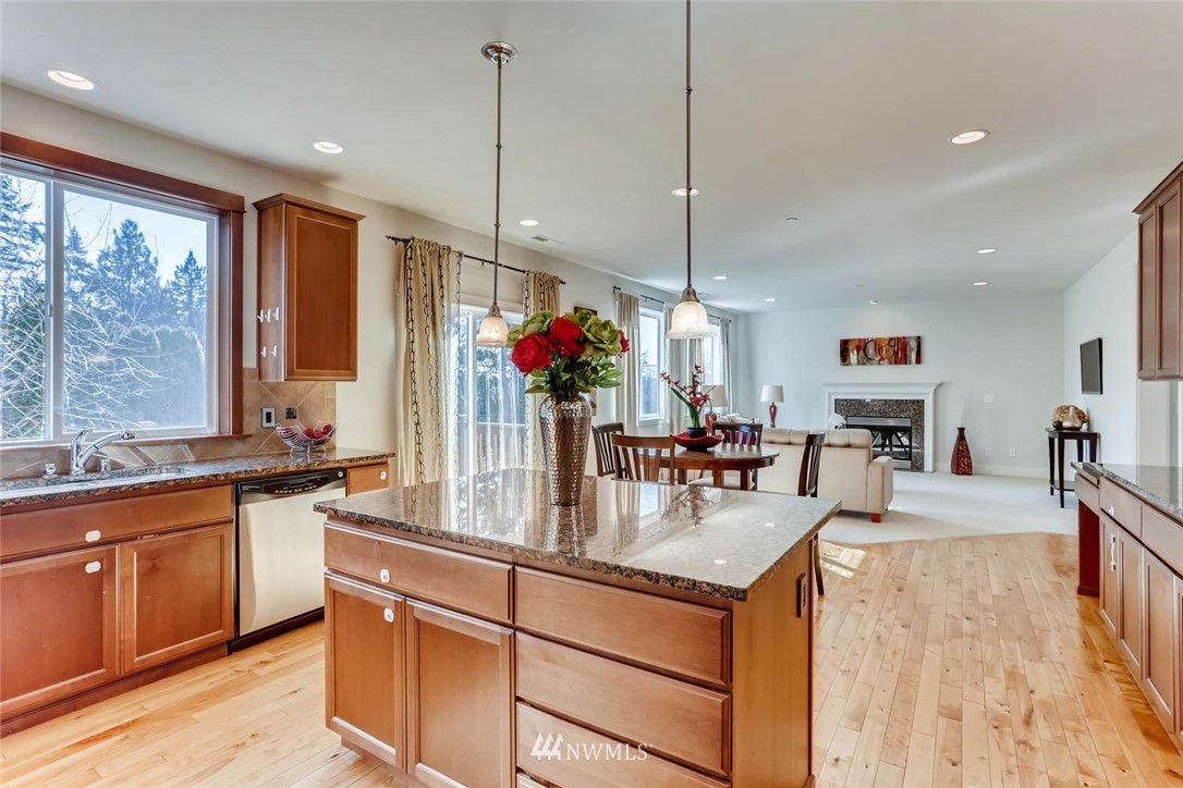3110 222nd Street Southeast Bothell, WA 98021 - Photo 9 of 23 a kitchen with sink a counter and chairs