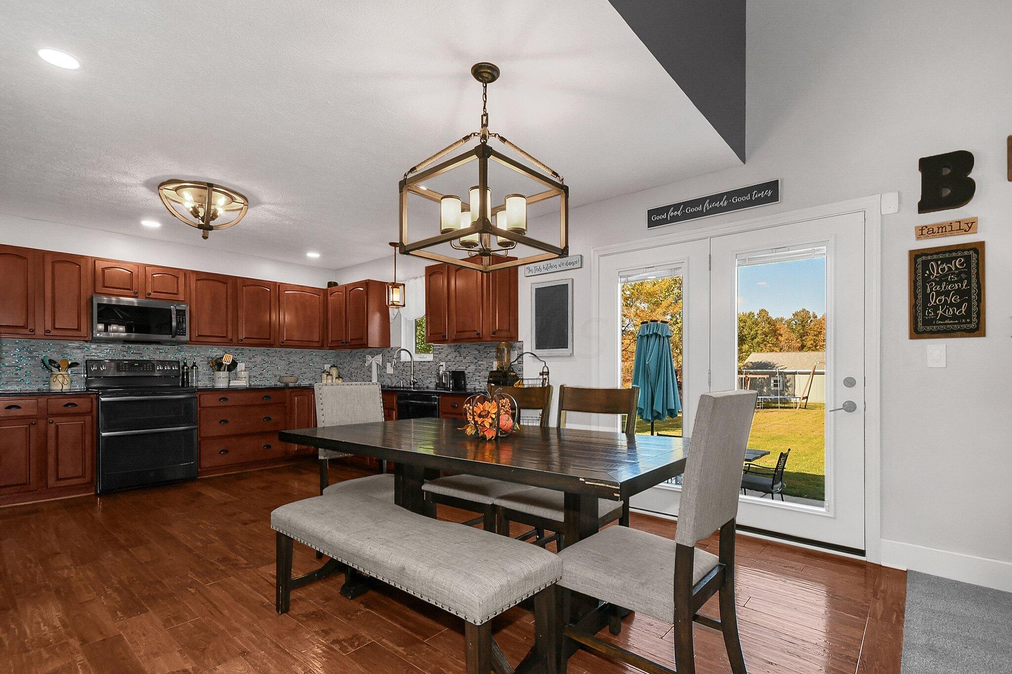 3620 Hyatts Road Powell, OH 43065 - Photo 14 of 54 Kitchen - granite countertops and hand scraped hickory floor, new custom lighting and recessed lighting.