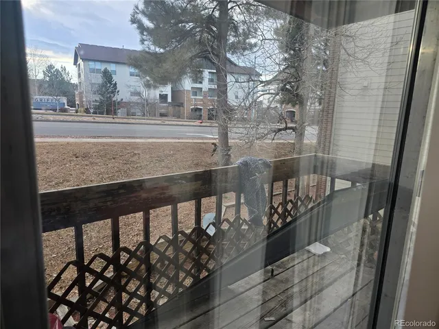 a view of a balcony with wooden floor