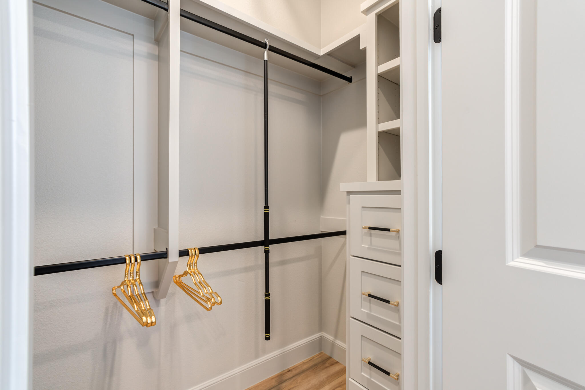 609 North 15th Street Wolfforth, TX 79382 - Photo 20 of 76 a view of walk in closet with empty racks