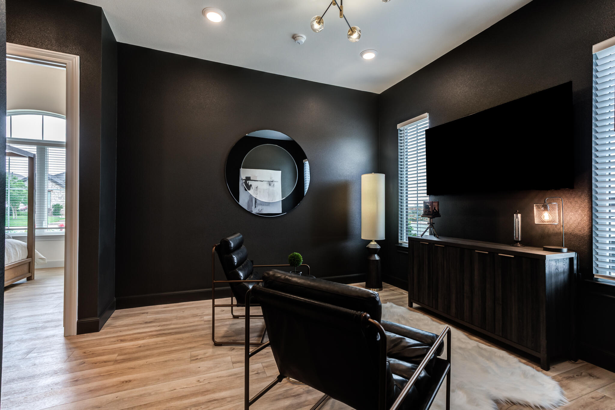609 North 15th Street Wolfforth, TX 79382 - Photo 21 of 76 a living room with furniture and a flat screen tv