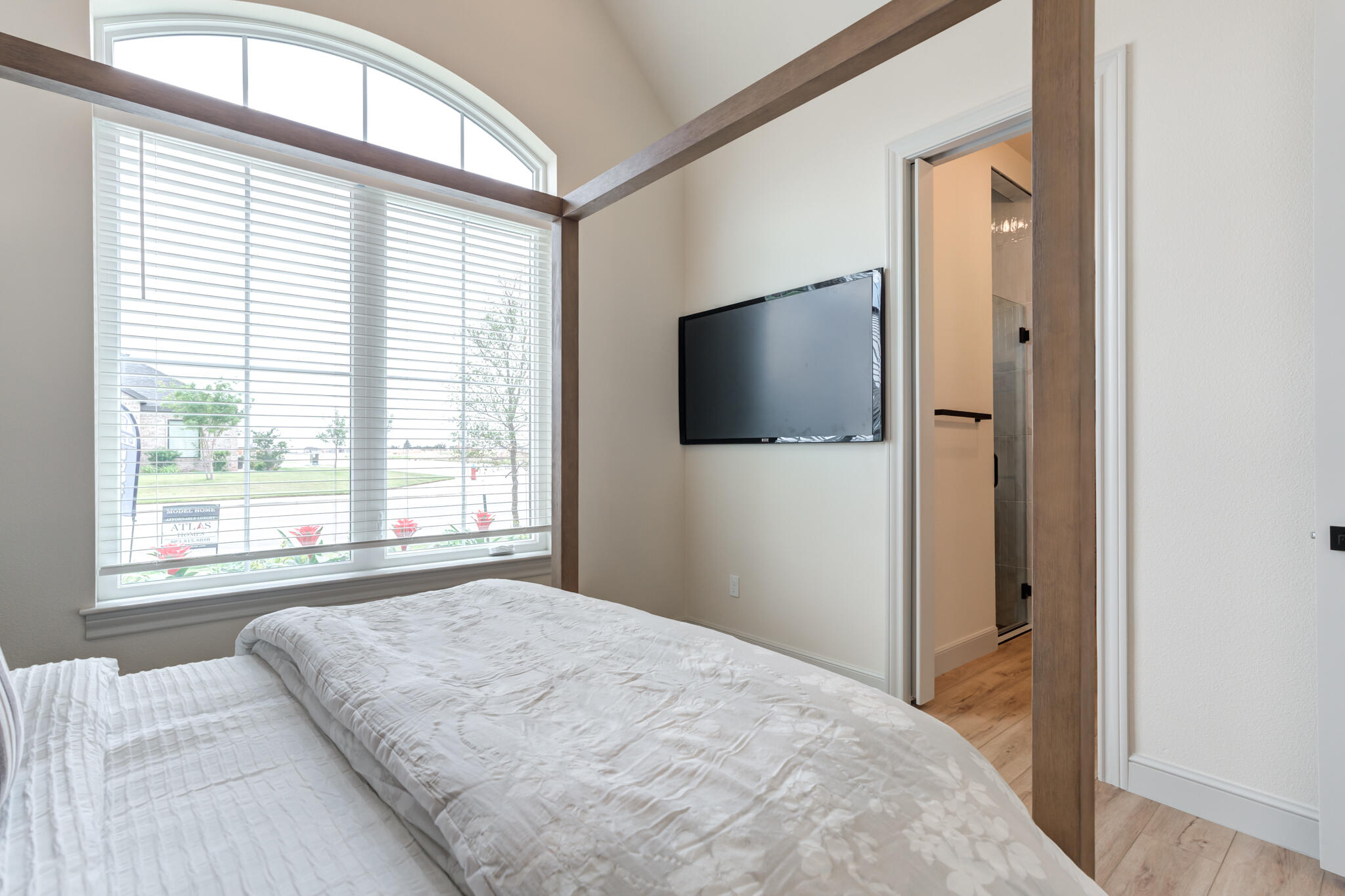 609 North 15th Street Wolfforth, TX 79382 - Photo 24 of 76 a bedroom with a bed and a flat screen tv