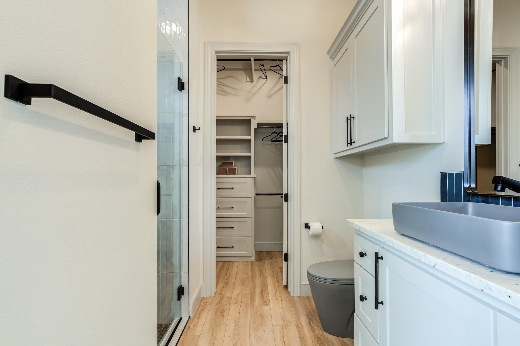 609 North 15th Street Wolfforth, TX 79382 - Photo 25 of 76 a bathroom with a granite countertop sink toilet and shower