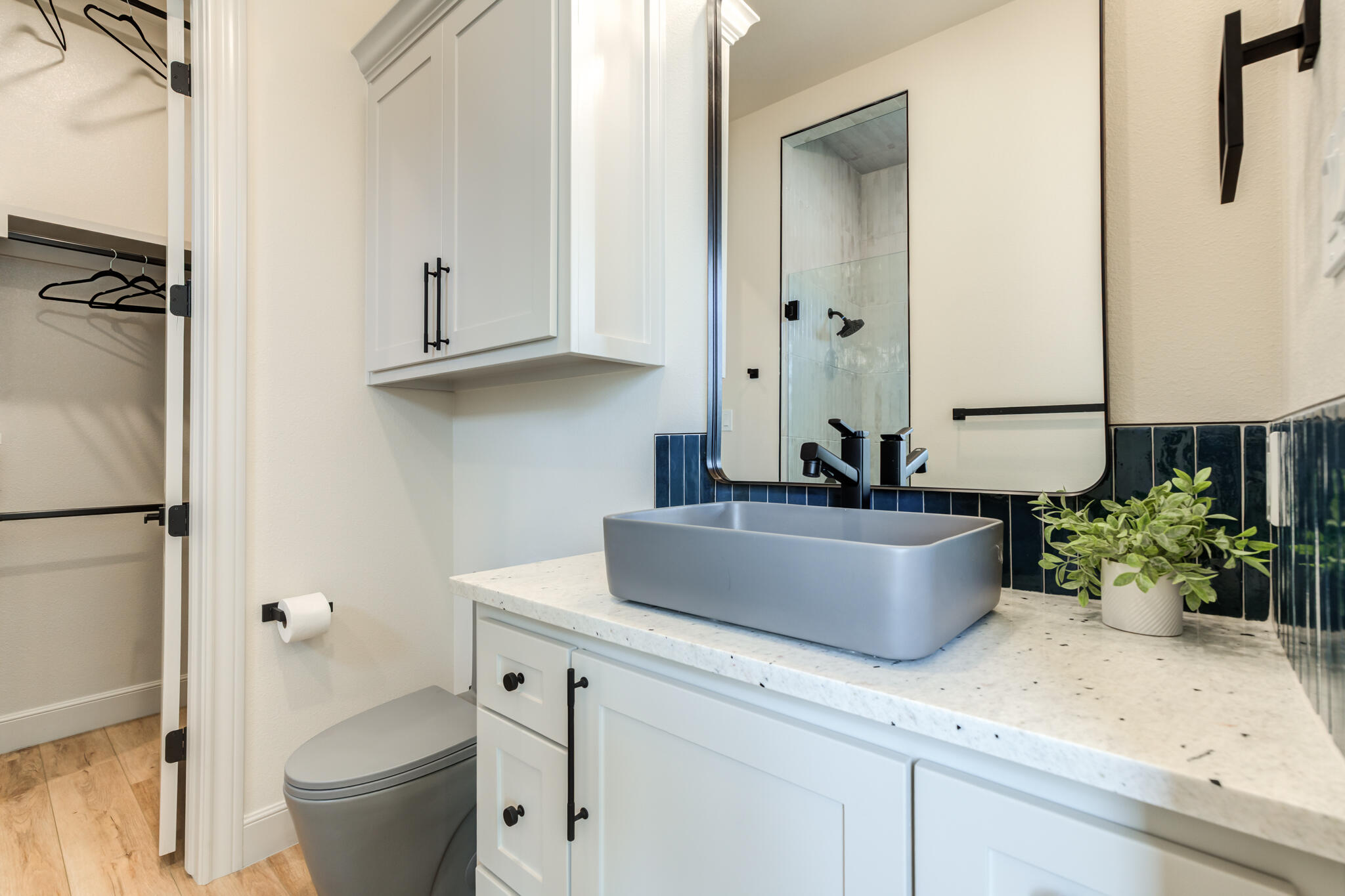 609 North 15th Street Wolfforth, TX 79382 - Photo 26 of 76 a view of bathroom with a sink and a mirror
