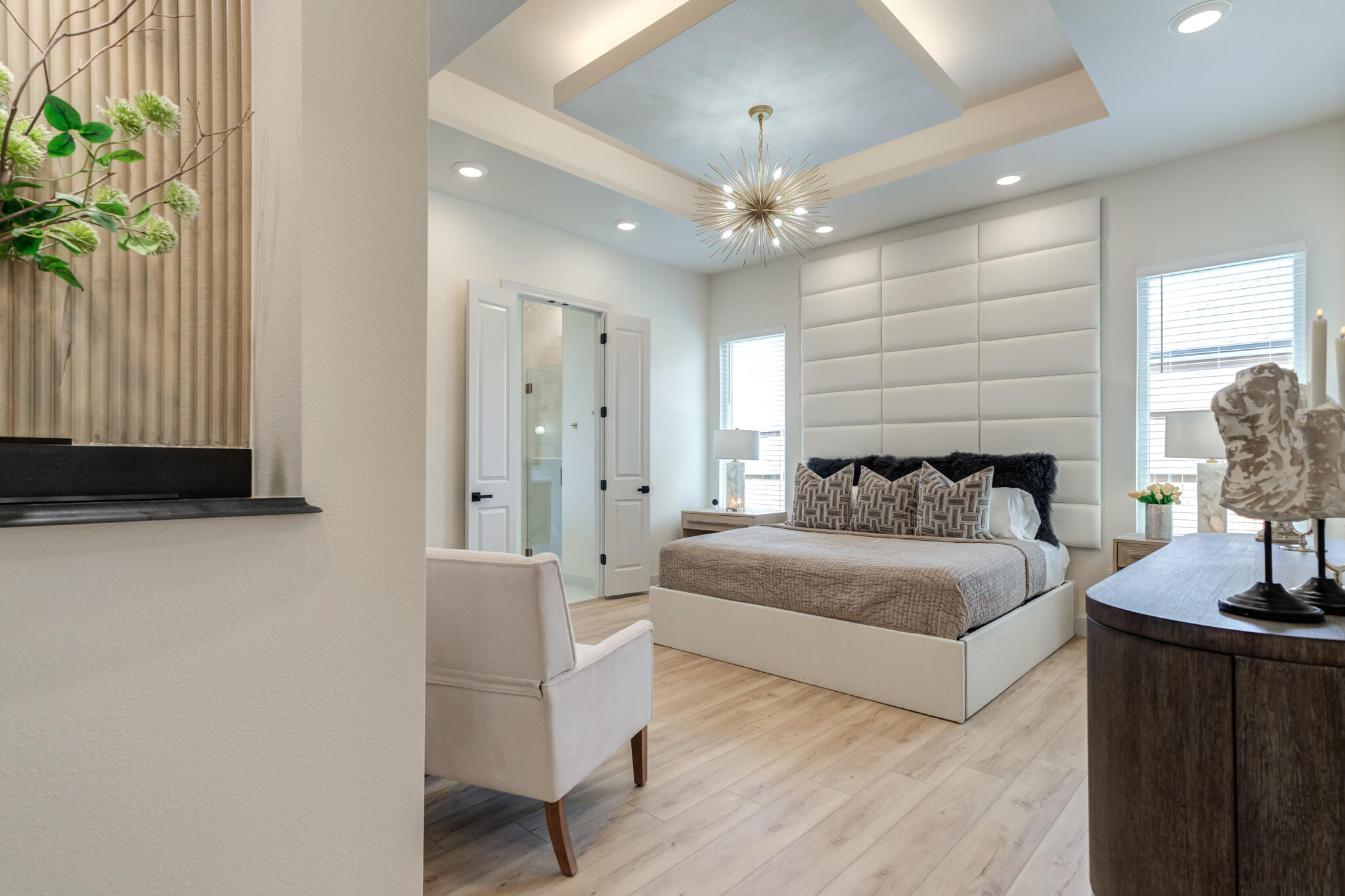 609 North 15th Street Wolfforth, TX 79382 - Photo 31 of 76 a spacious bedroom with a bed and a couch