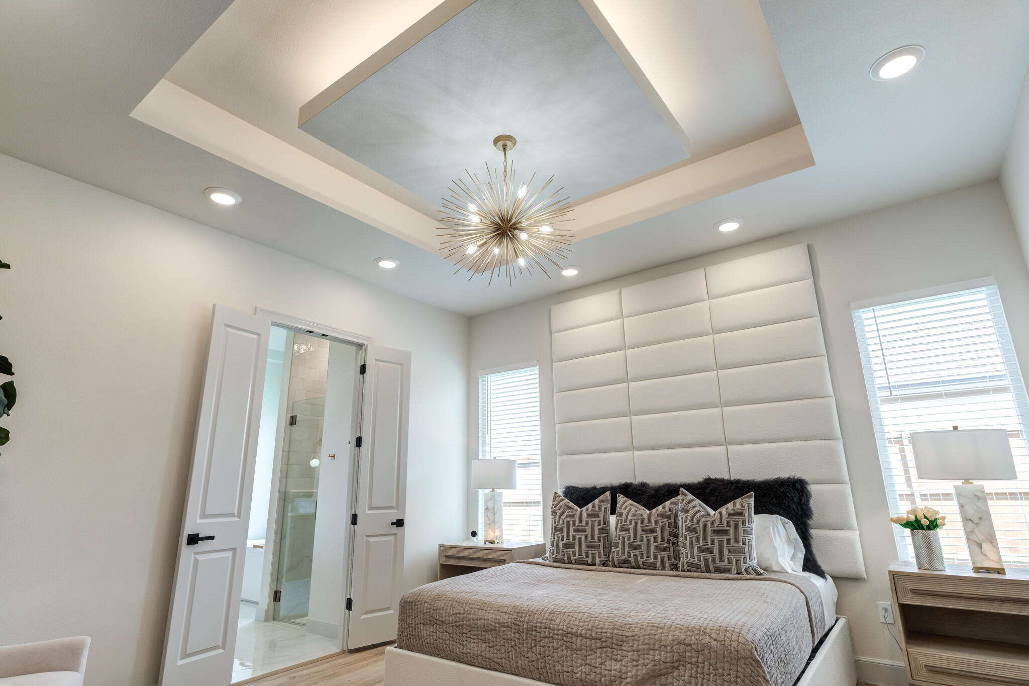 609 North 15th Street Wolfforth, TX 79382 - Photo 33 of 76 a bedroom with a bed and a chandelier