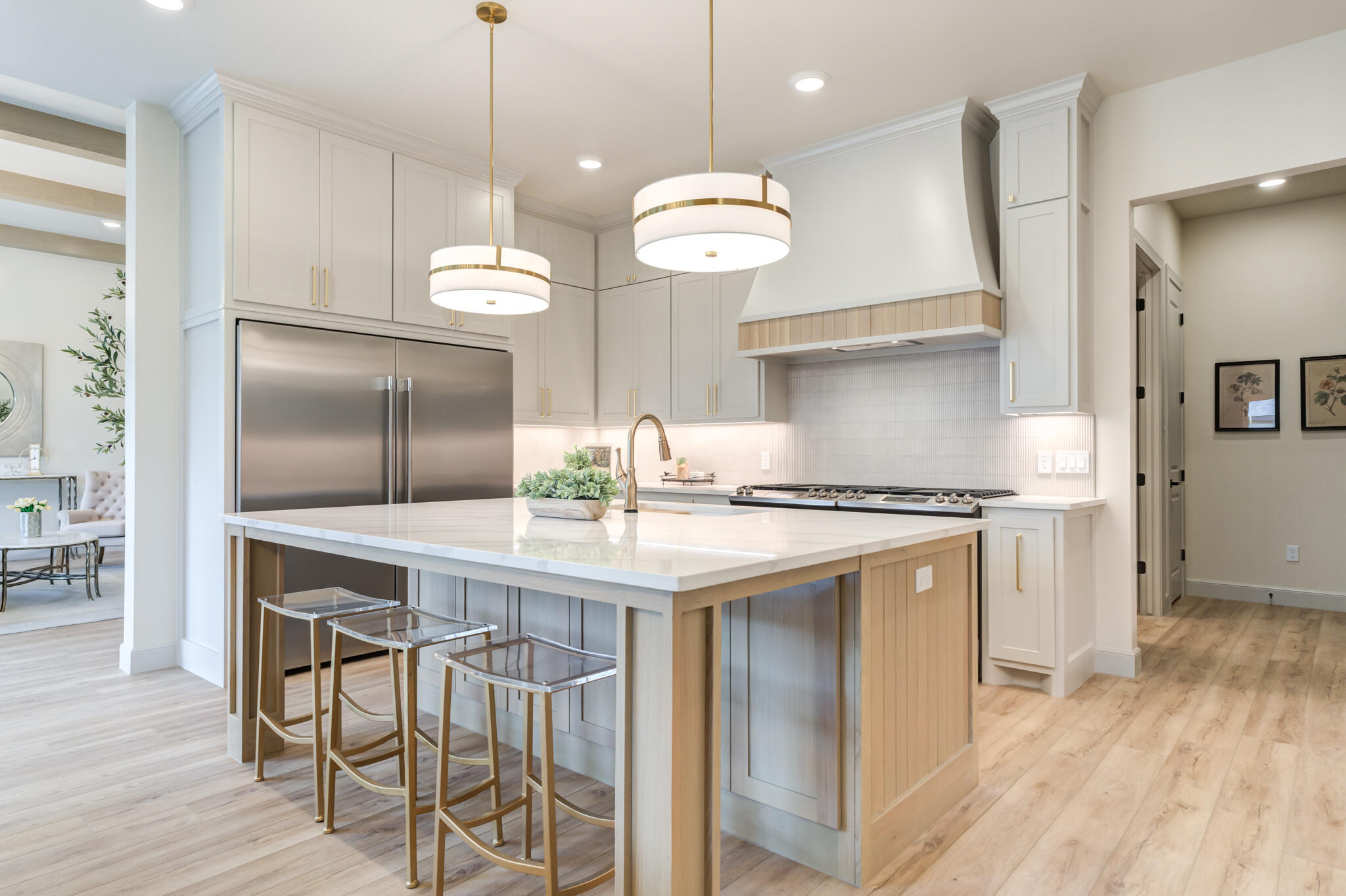 609 North 15th Street Wolfforth, TX 79382 - Photo 53 of 76 a kitchen with cabinets wooden floor and stainless steel appliances