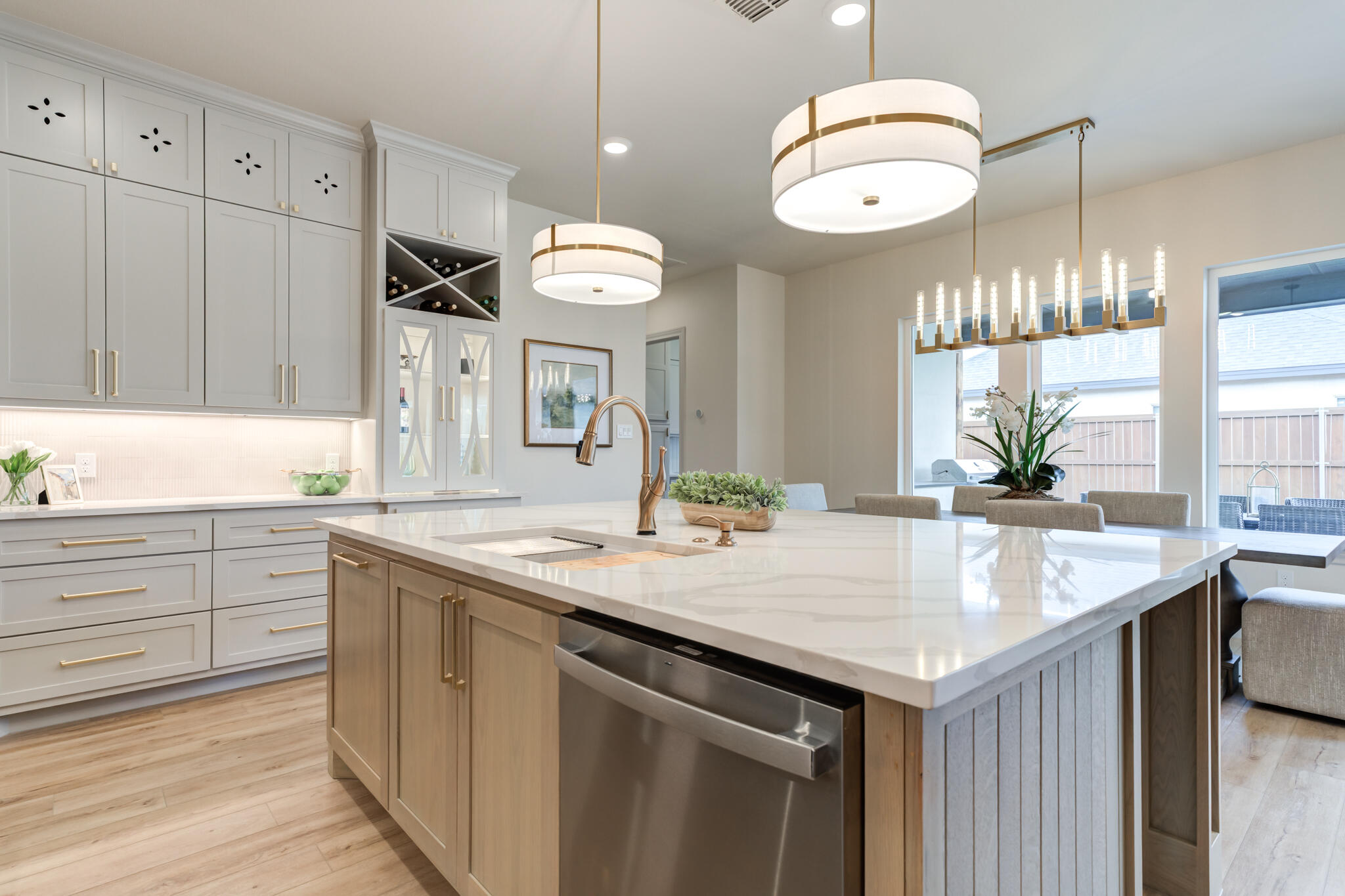 609 North 15th Street Wolfforth, TX 79382 - Photo 60 of 76 a kitchen with a sink and dishwasher with wooden floor
