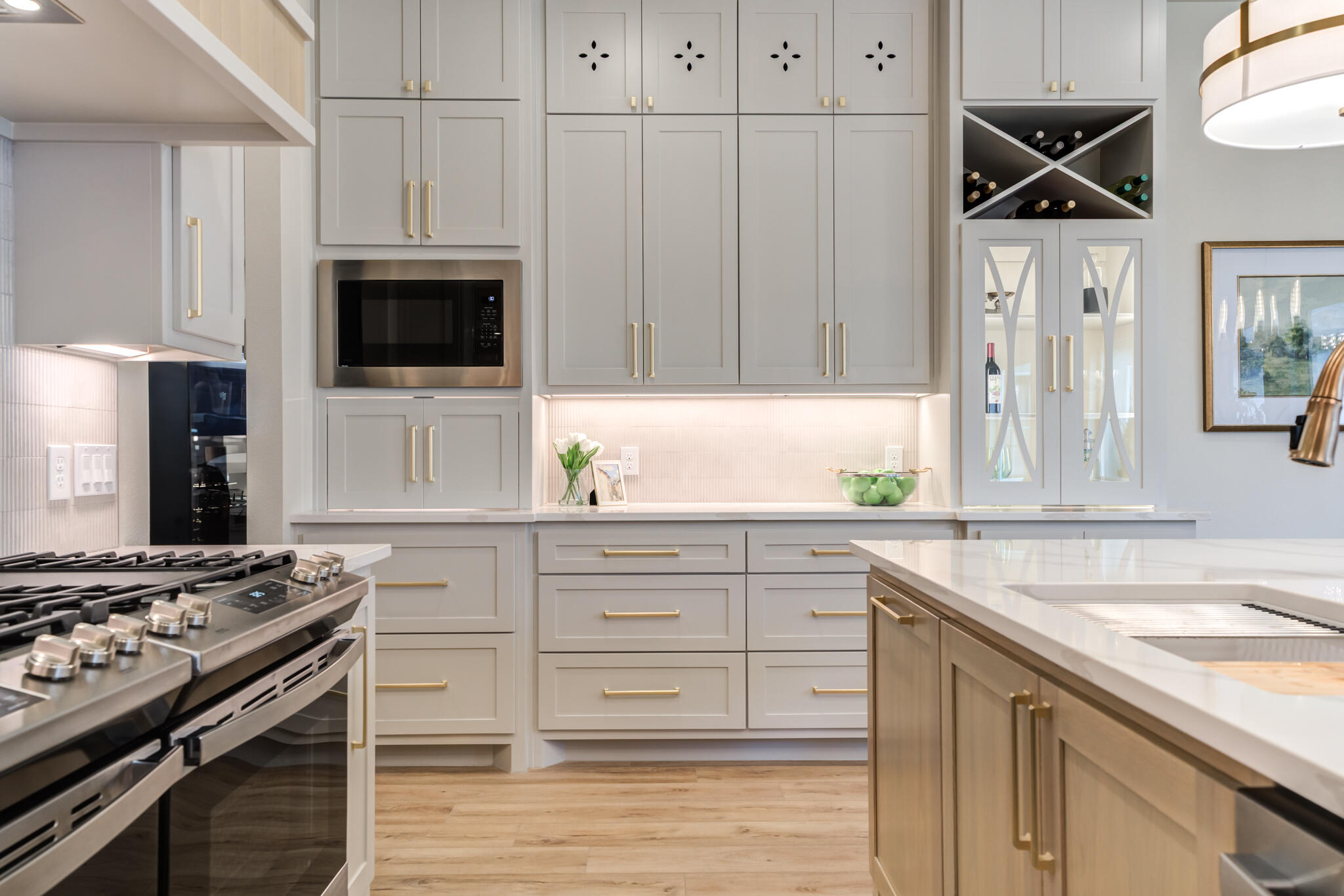 609 North 15th Street Wolfforth, TX 79382 - Photo 62 of 76 a kitchen with granite countertop a sink stainless steel appliances and white cabinets
