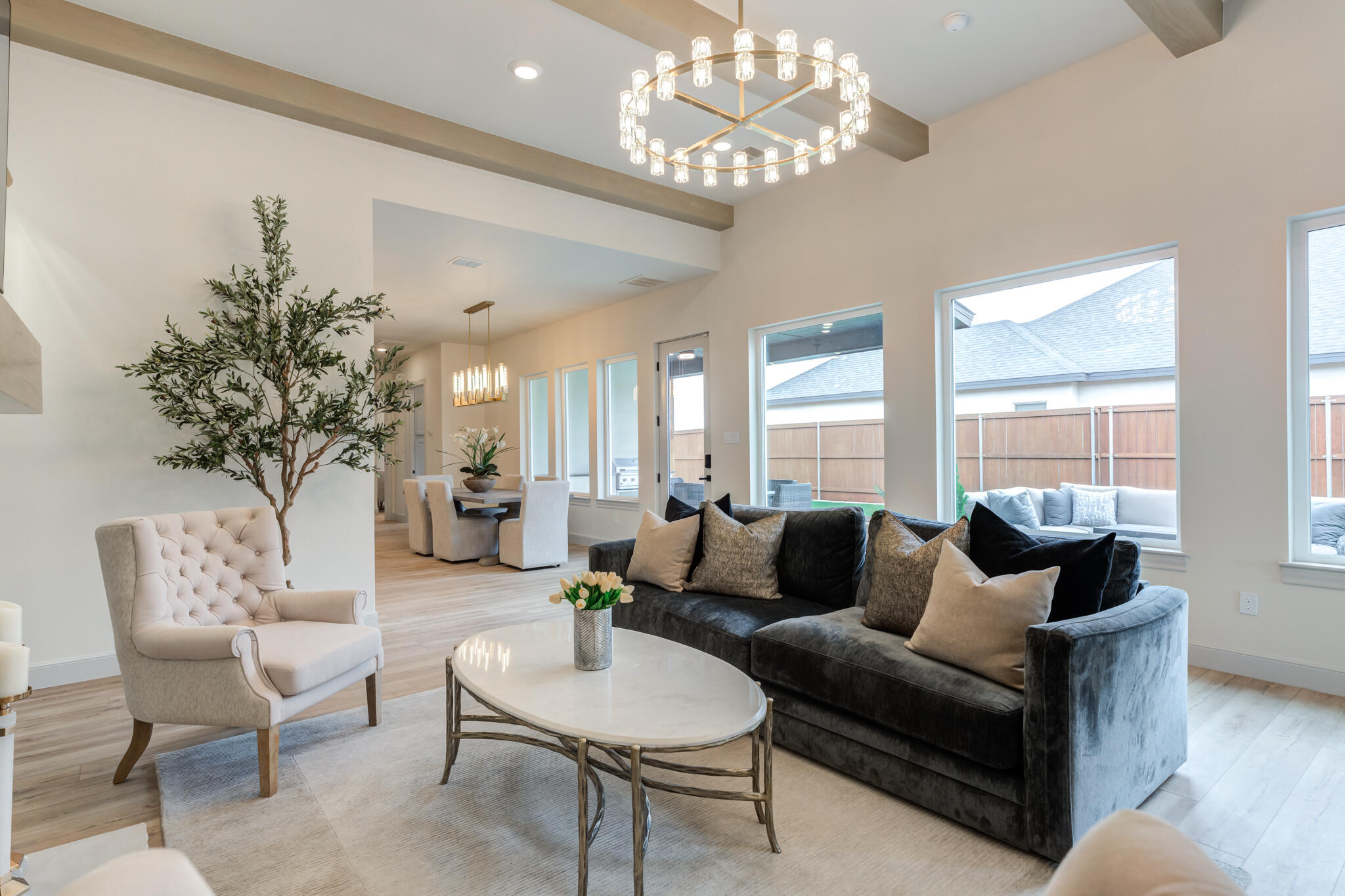 609 North 15th Street Wolfforth, TX 79382 - Photo 70 of 76 a living room with furniture and a chandelier