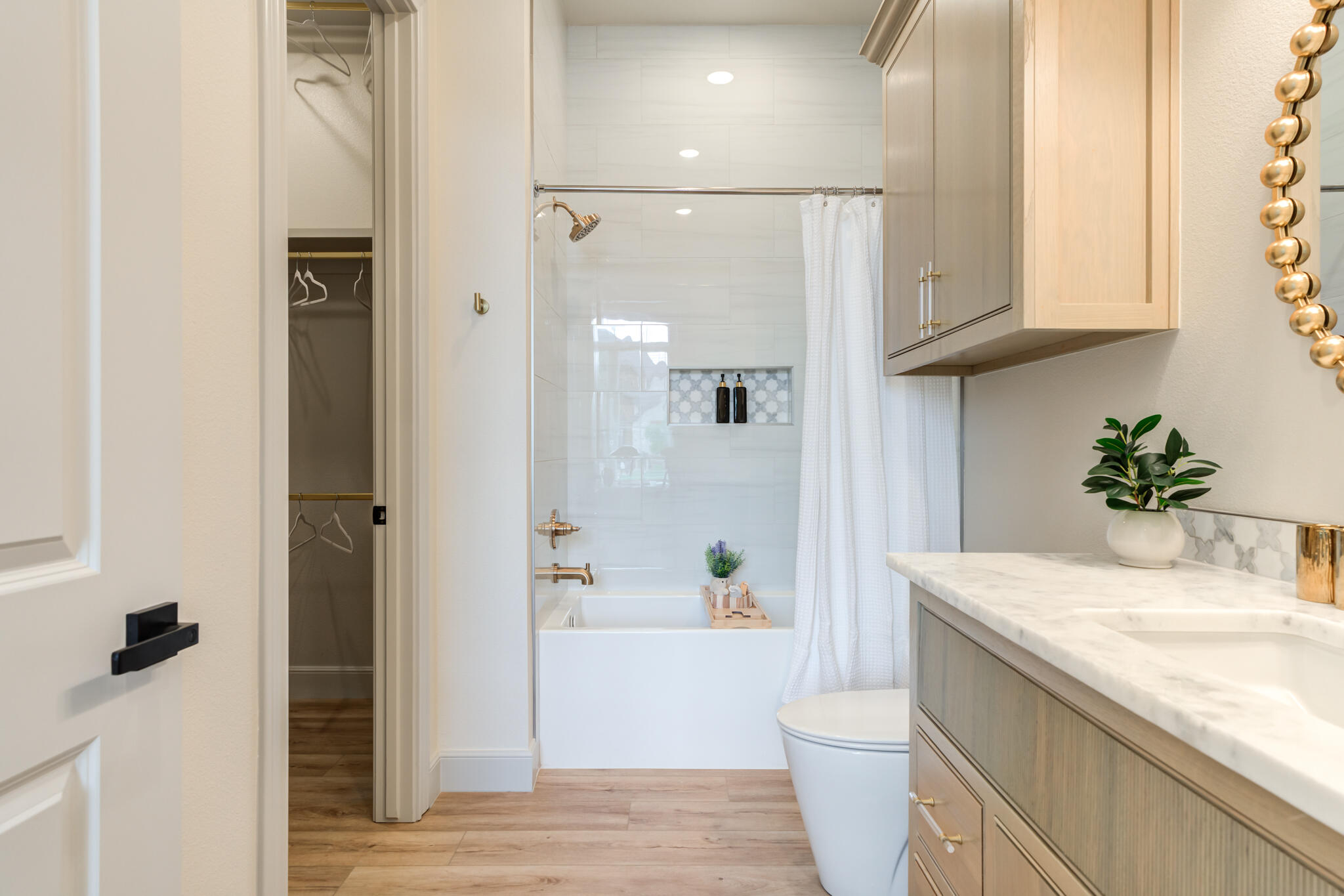 609 North 15th Street Wolfforth, TX 79382 - Photo 8 of 76 a bathroom with a granite countertop sink a toilet and shower
