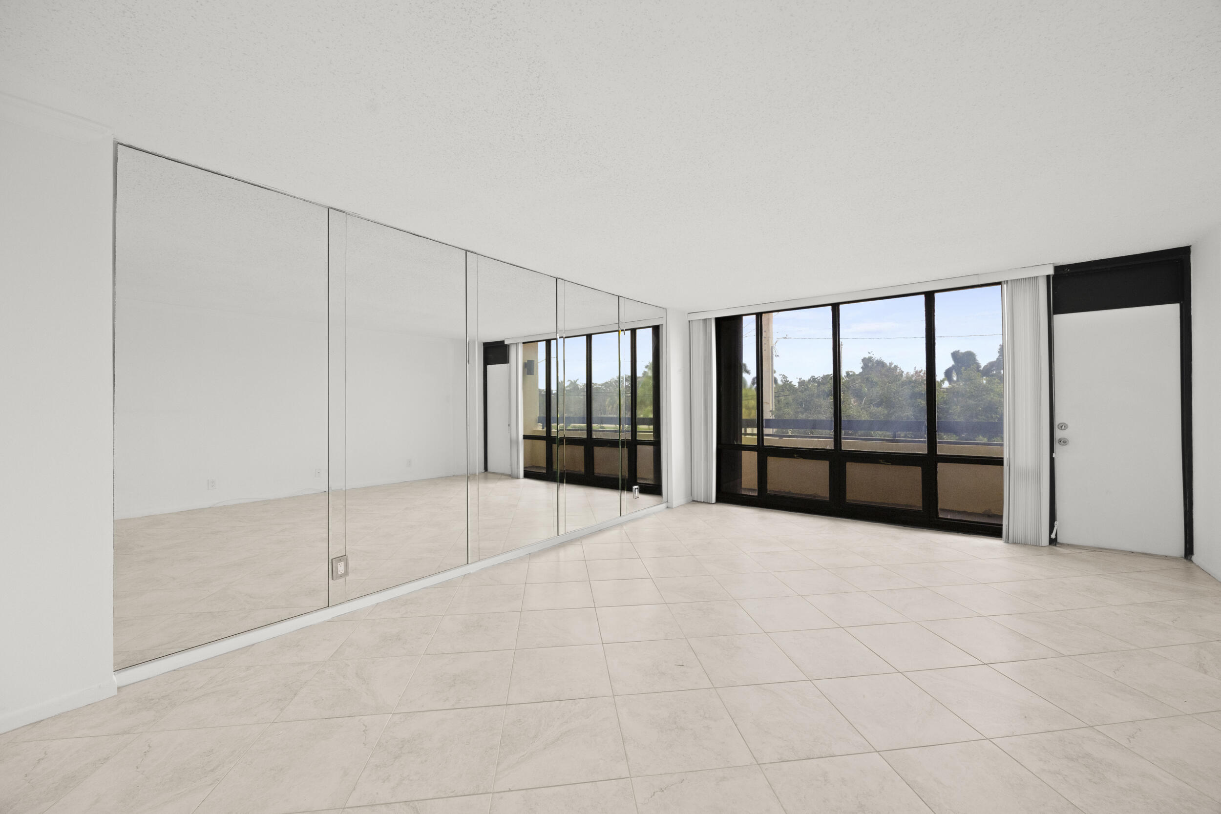 Undisclosed Address Boca Raton, FL 33432 - Photo 11 of 27 a view of an empty room with a window