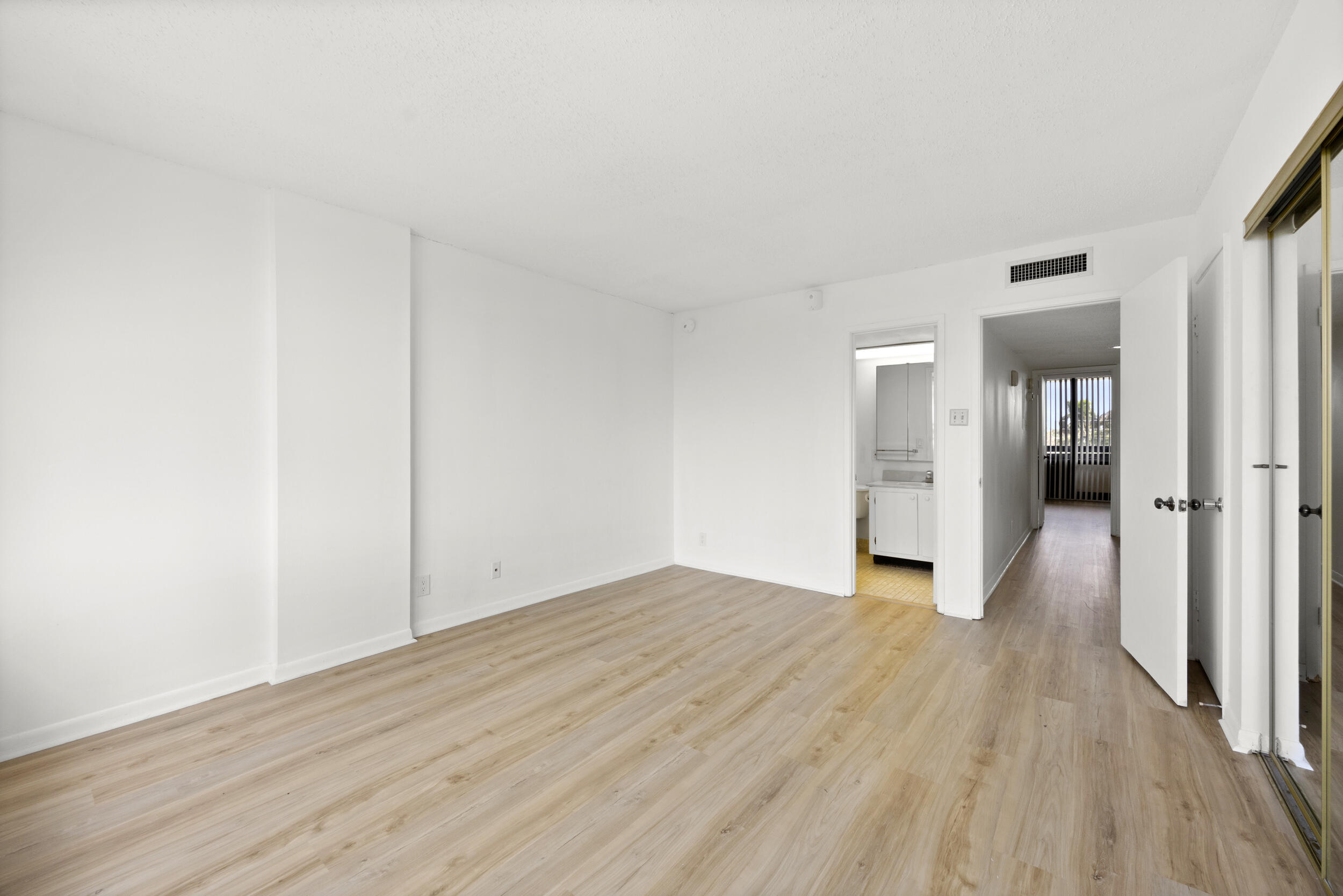 Undisclosed Address Boca Raton, FL 33432 - Photo 23 of 27 a view of empty room with wooden floor