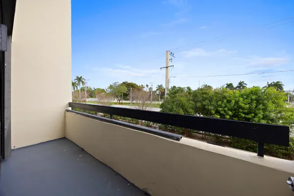 a view of balcony with furniture