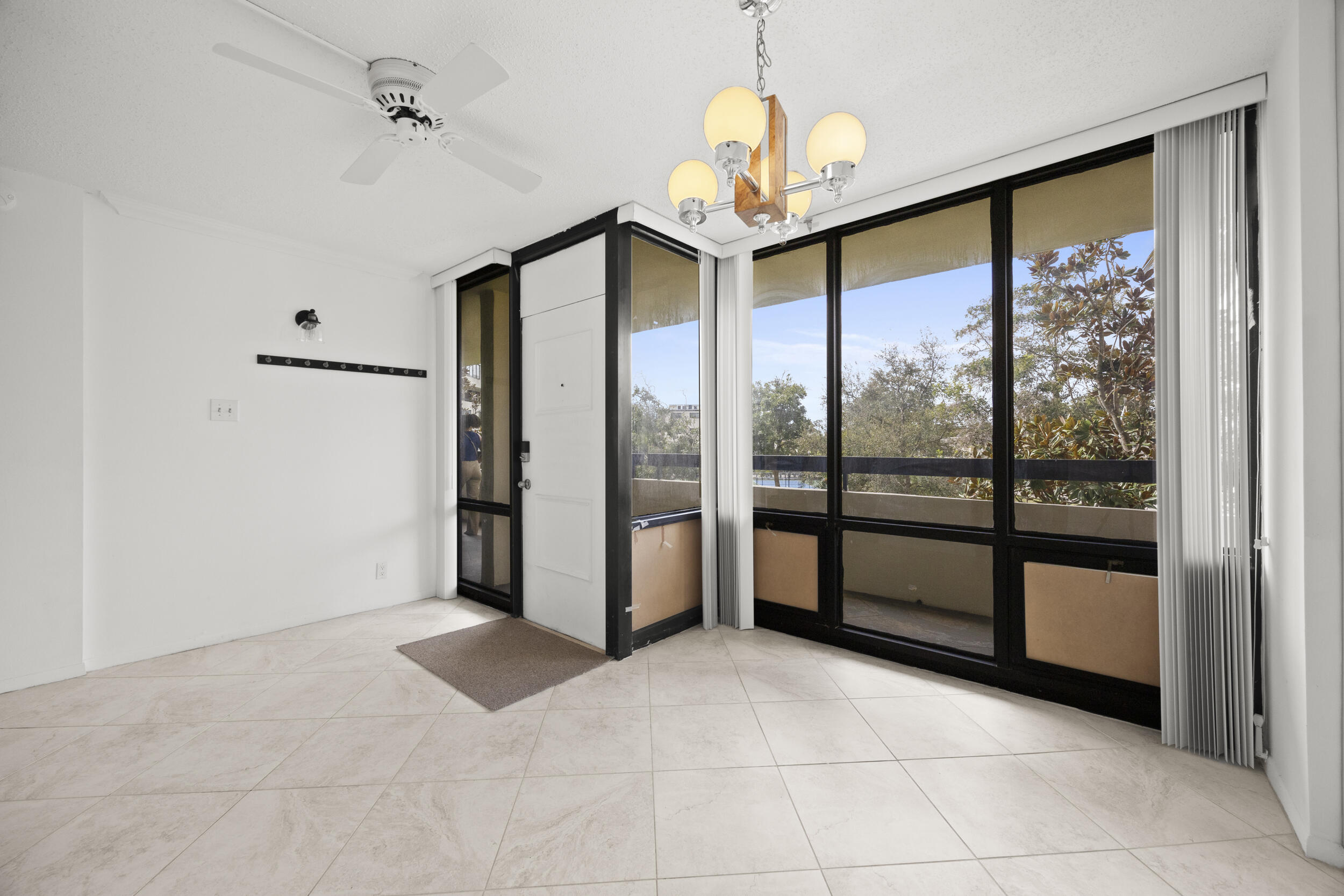 Undisclosed Address Boca Raton, FL 33432 - Photo 5 of 27 a view of an empty room with a window