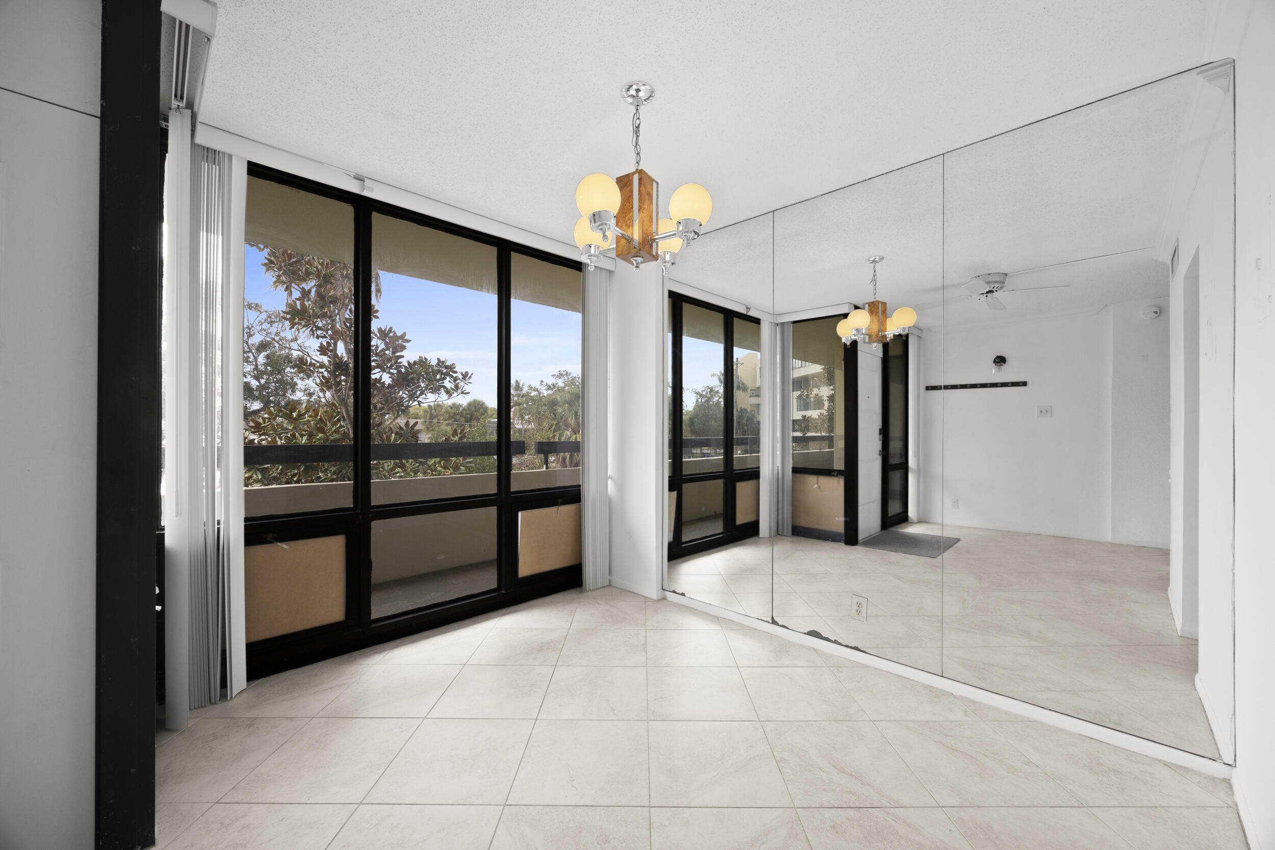 Undisclosed Address Boca Raton, FL 33432 - Photo 9 of 27 a view of an entryway with a chandelier