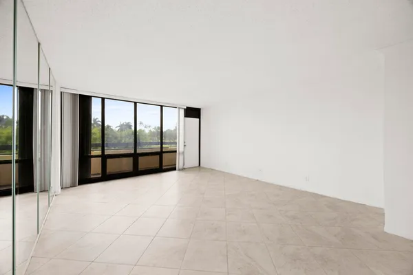 a view of an empty room with a balcony