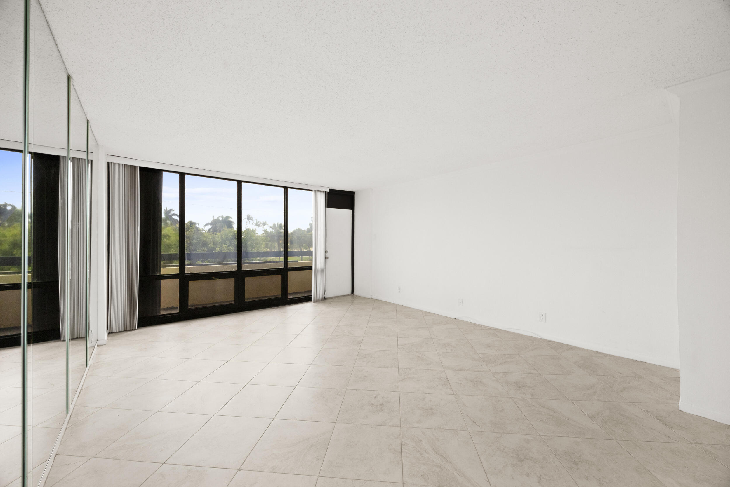 Undisclosed Address Boca Raton, FL 33432 - Photo 10 of 27 a view of an empty room with a balcony
