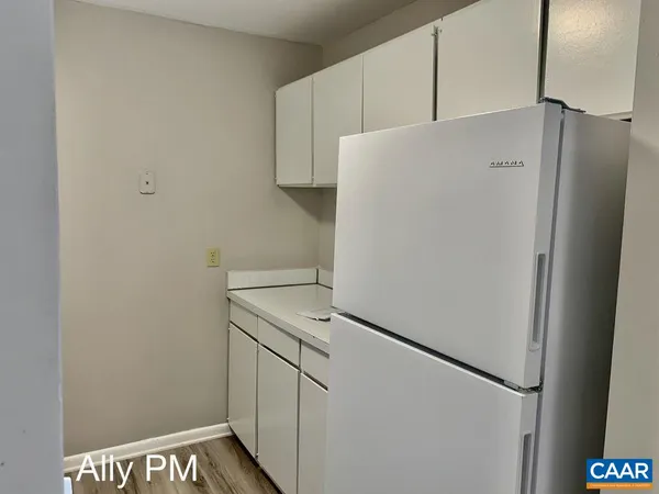 a white refrigerator freezer sitting in a kitchen