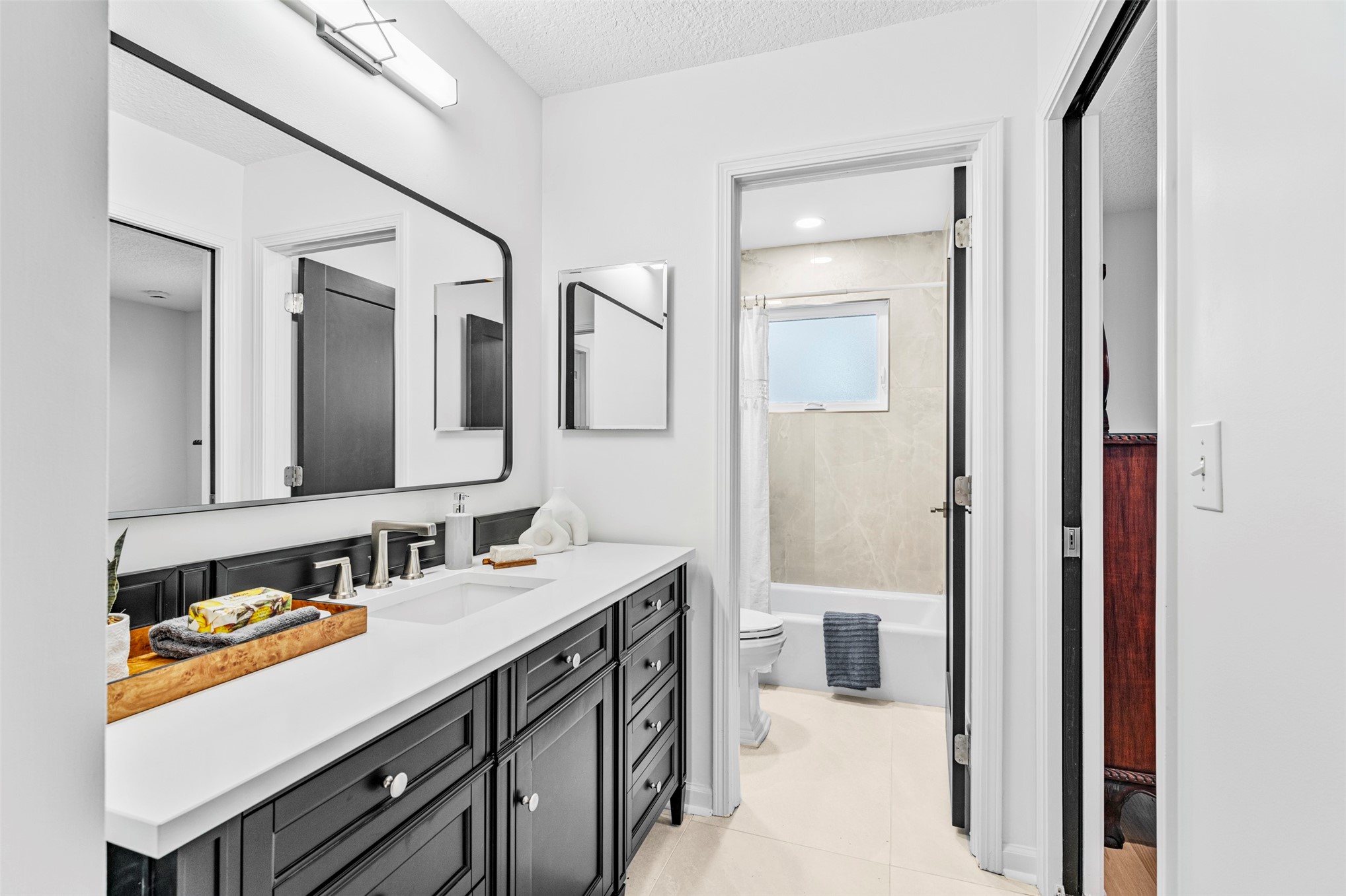 4708 Rigging Drive Fernandina Beach, FL 32034 - Photo 20 of 32 a en suite bathroom with a granite countertop sink and a mirror