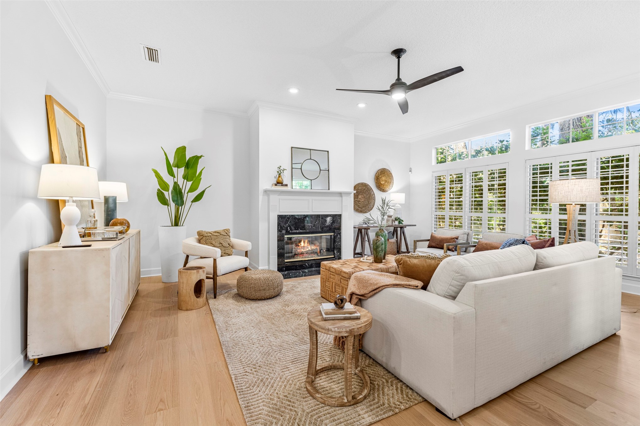 4708 Rigging Drive Fernandina Beach, FL 32034 - Photo 6 of 32 a living room with furniture a fireplace and a large window