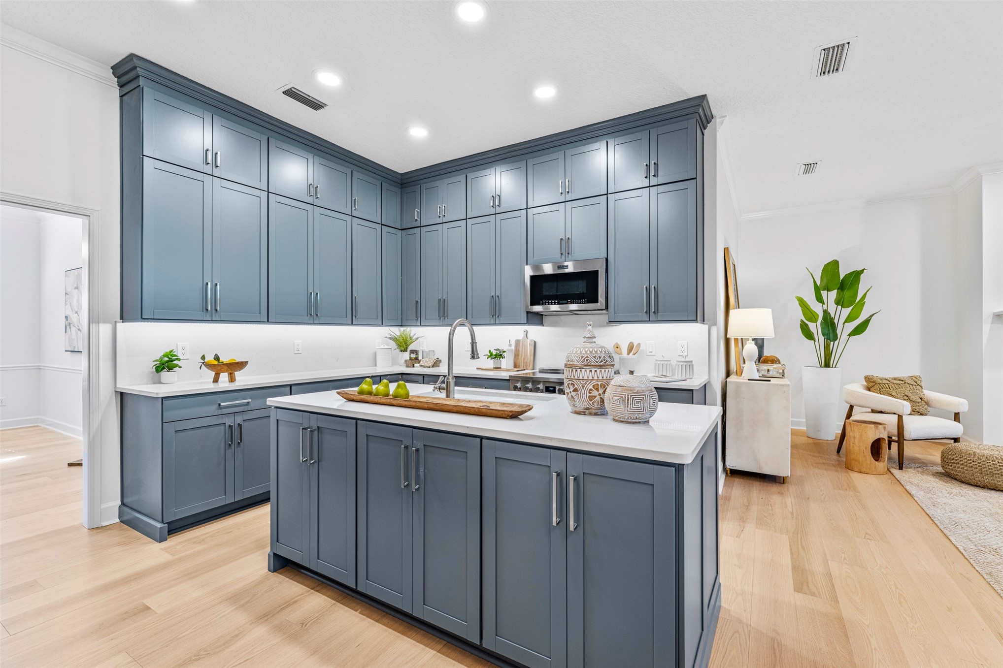 4708 Rigging Drive Fernandina Beach, FL 32034 - Photo 8 of 32 a kitchen with a sink refrigerator and wooden floor