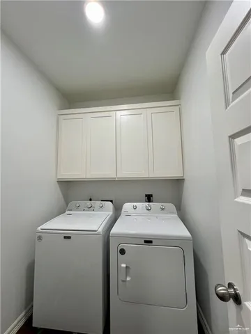 a bed sitting in a room next to a window