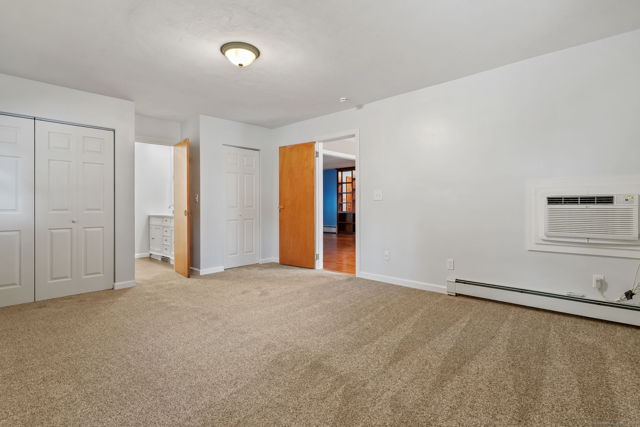 1 Chapman Avenue Waterford, CT 06385 - Photo 18 of 39 an empty room with windows and closet