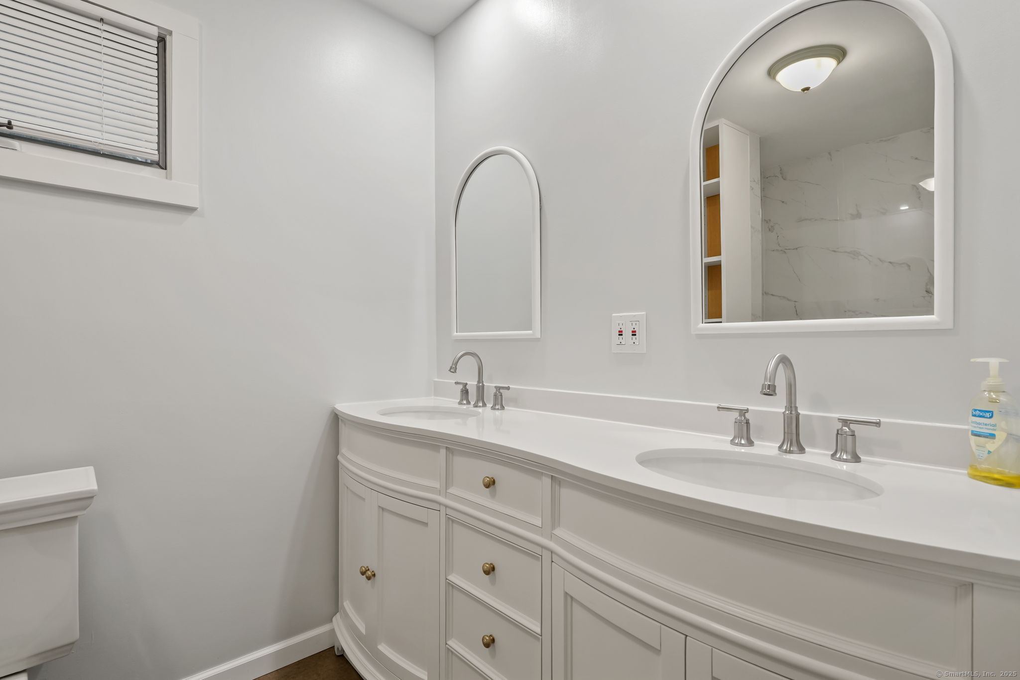 1 Chapman Avenue Waterford, CT 06385 - Photo 20 of 39 a bathroom with a sink and a mirror