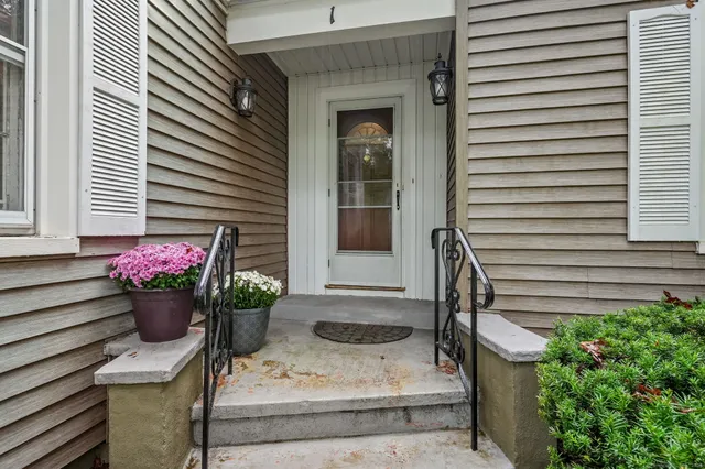 a view of a house with chairs