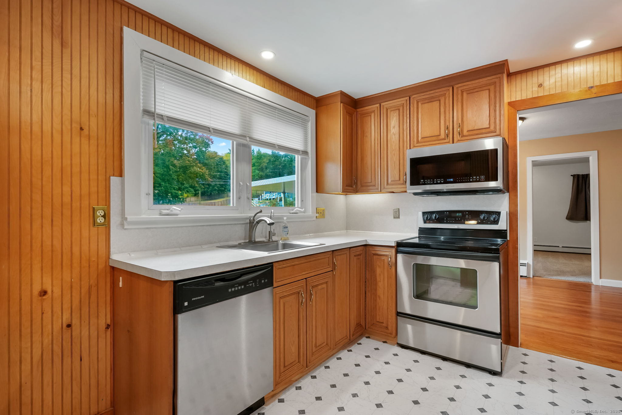1 Chapman Avenue Waterford, CT 06385 - Photo 21 of 39 a kitchen with stainless steel appliances a stove a sink and a microwave