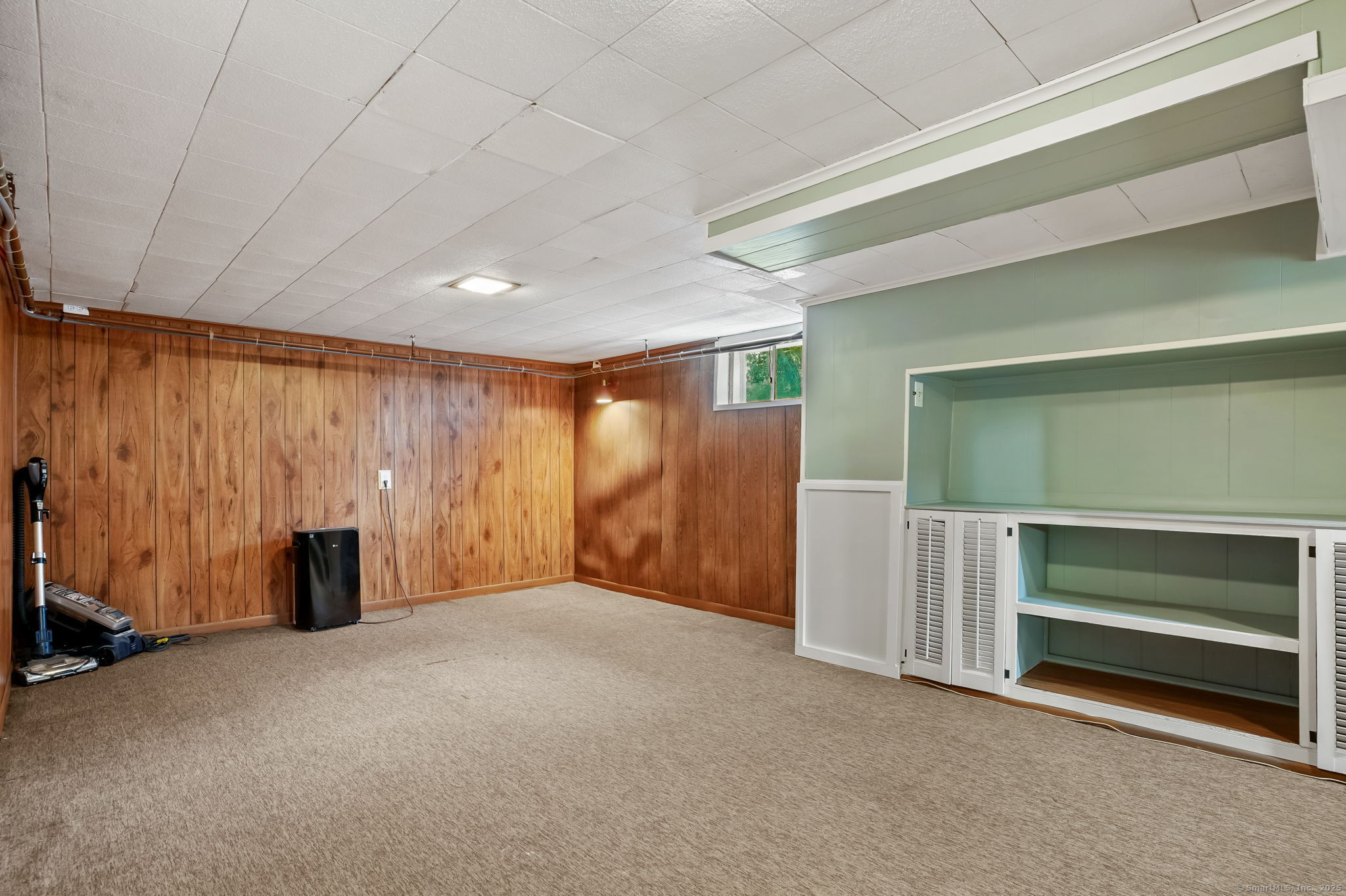 1 Chapman Avenue Waterford, CT 06385 - Photo 31 of 39 a view of an empty room with a fireplace and a window