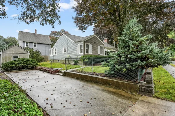 a view of a chair and tables in the patio