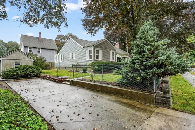 a view of a chair and tables in the patio