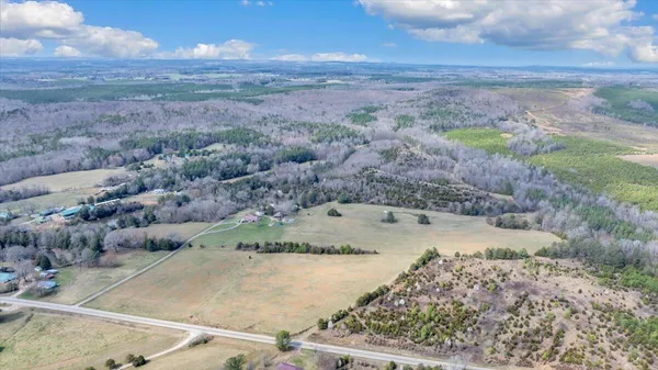 a view of a yard with a mountain