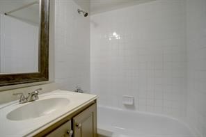 1304 Robin Street Houston, TX 77019 - Photo 6 of 11 Large en suite bath with plenty of storage, large framed mirror and tub with shower.
