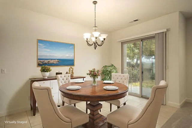 a view of a dining room with furniture window and outside view