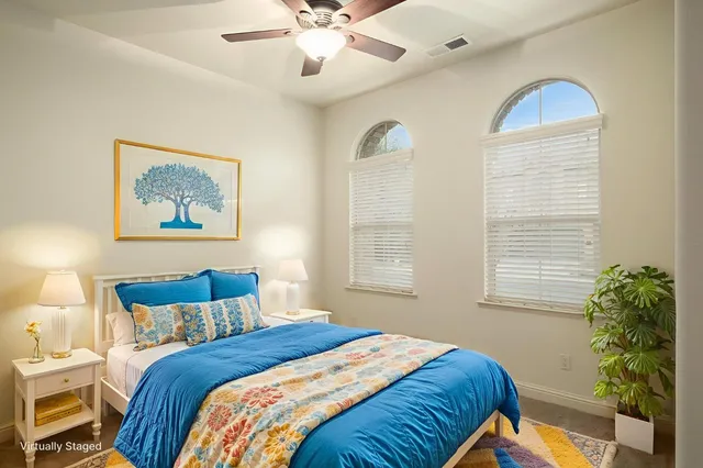 a bedroom with bed and a window