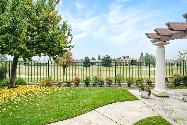 a view of a garden with a lake