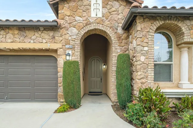a front view of a house with garden