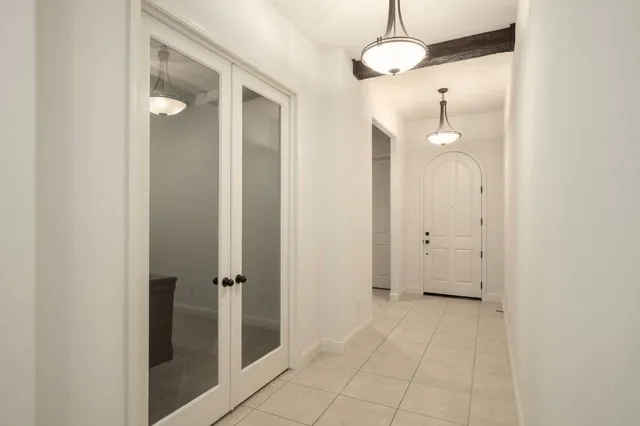 a view of a bathroom with a shower and a mirror