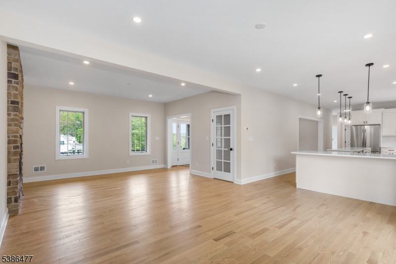 5 Percy Place Andover, NJ 07821 - Photo 11 of 50 an empty room with wooden floor and windows