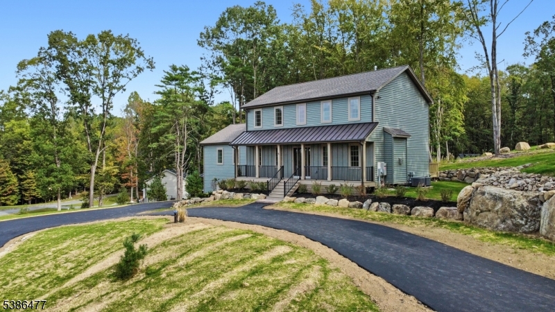 5 Percy Place Andover, NJ 07821 - Photo 2 of 50 a front view of a house with swimming pool and sitting area