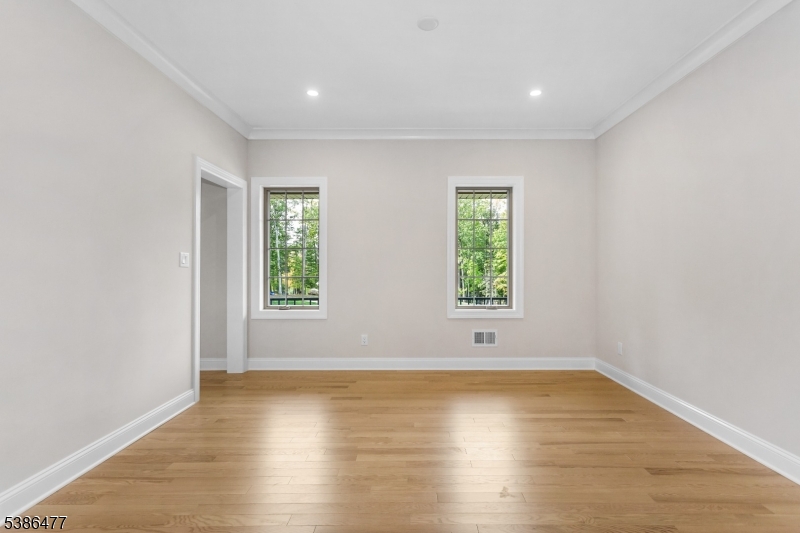 5 Percy Place Andover, NJ 07821 - Photo 25 of 50 an empty room with wooden floor and window
