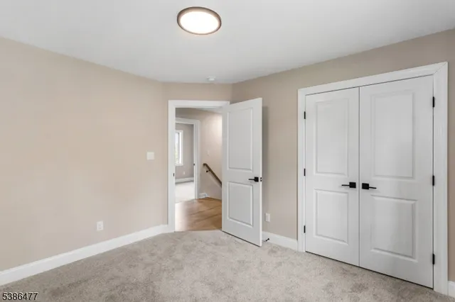 an empty room with closet area