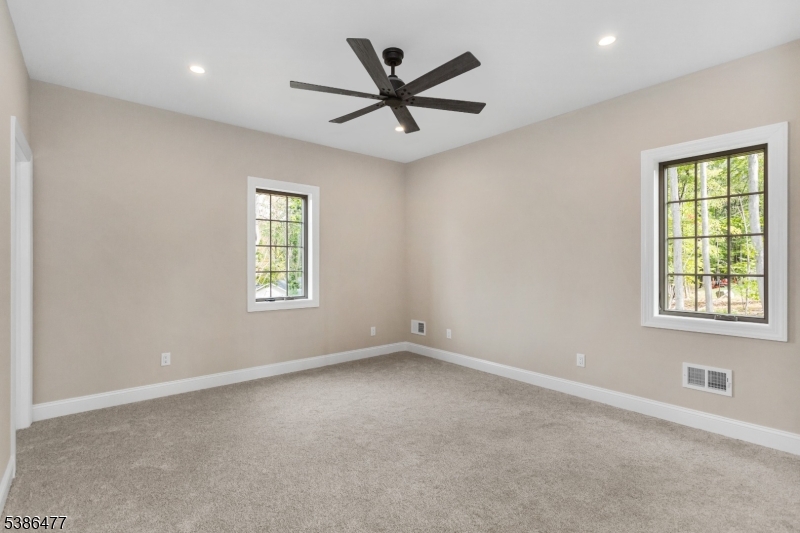 5 Percy Place Andover, NJ 07821 - Photo 40 of 50 an empty room with ceiling fan and windows