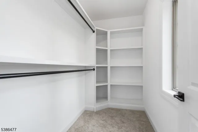 a view of an empty walk in closet