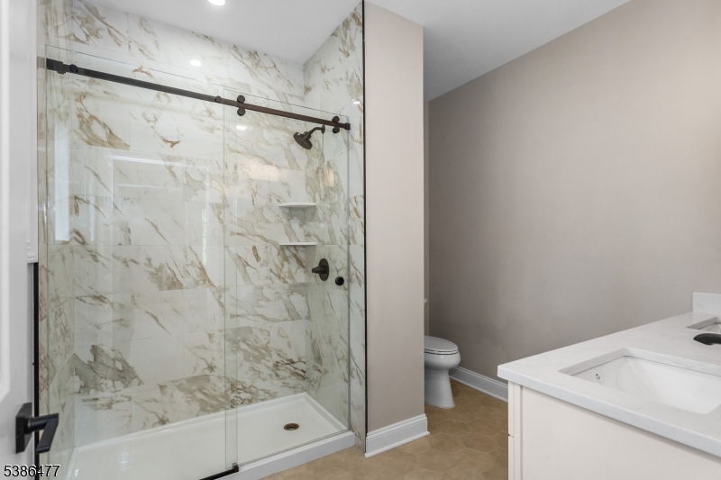 5 Percy Place Andover, NJ 07821 - Photo 43 of 50 a bathroom with a shower toilet and sink